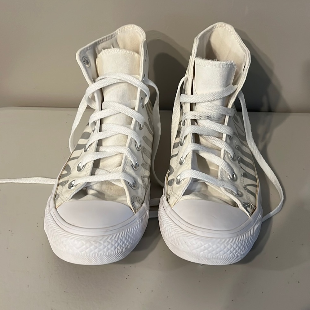 White and silver Chuck Taylor high tops